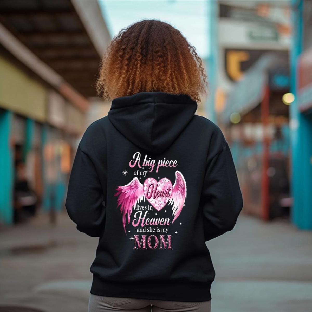 Back view of the parke horizon hoodie displaying 'A Big Piece Of My Heart Lives In Heaven Mom' angel wing back-print graphic artwork on a soft fleece pullover. - dogmomhat