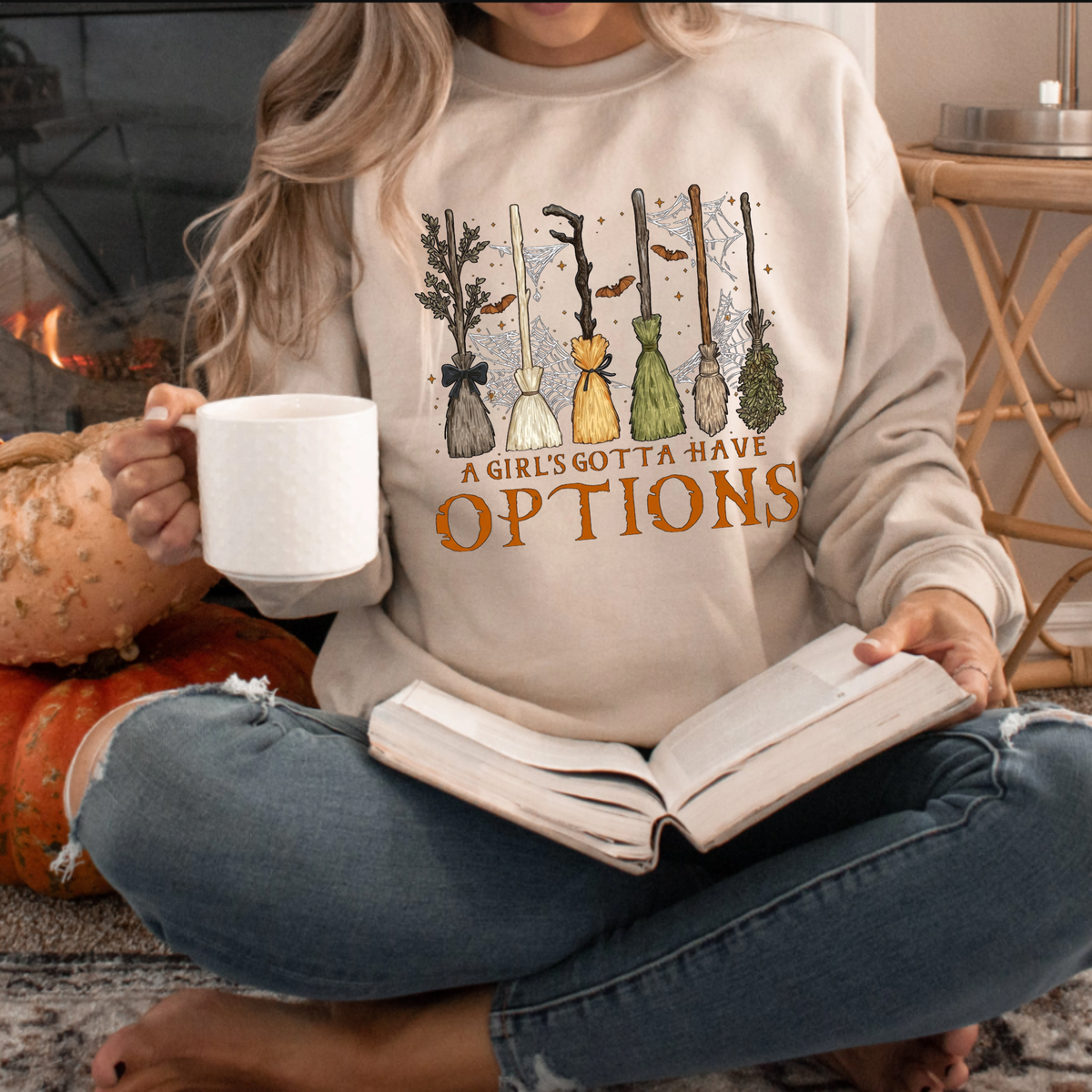Front view of the A Girl Gotta Have Options Retro Y2K Halloween Sweatshirt displaying witchy potion graphics printed across the chest of a casual fleece crewneck. - hiyamart