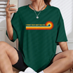 Front view of the eighties anthem callback tee displaying retro rainbow stripes and 80s music humor typography across the chest of a cotton shirt. - dogmomhat