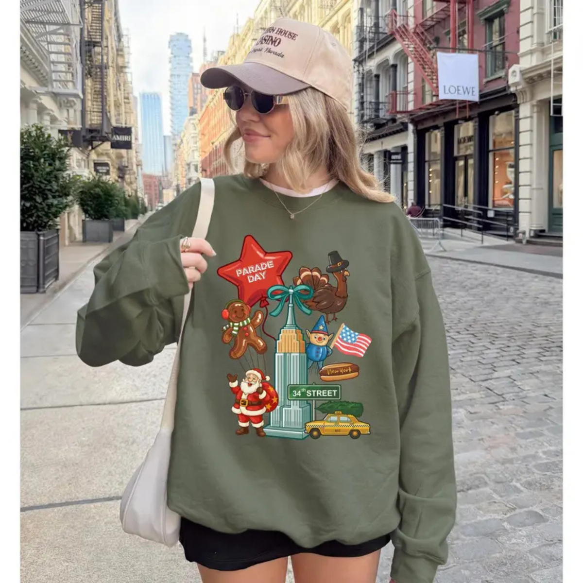 Front view of the festive friction crewneck displaying retro NYC Thanksgiving Day Parade graphic artwork across the chest of a soft fleece sweatshirt. - hiyamart