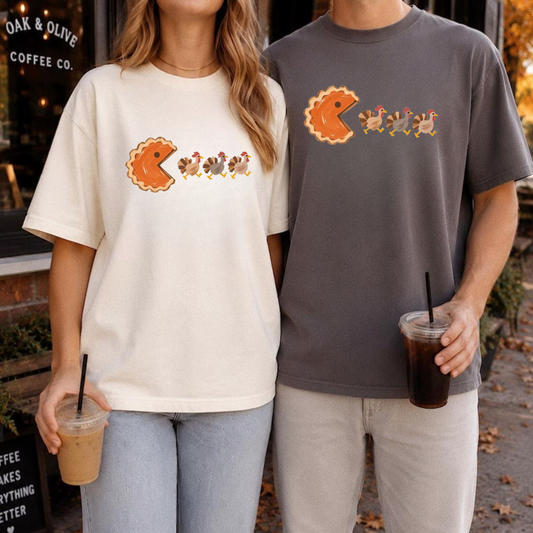 Front view of the gobble maze tee displaying funny retro pumpkin pacman Thanksgiving graphic artwork across the chest of a garment-dyed shirt. - dogmomhat