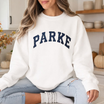 Front view of the parke horizon crewneck displaying clean preppy 'PARKE' varsity graphic typography across the chest of a soft fleece sweatshirt. - hiyamart