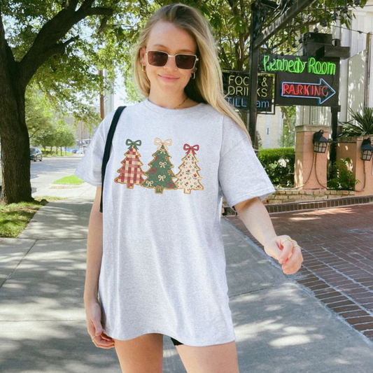 Front view of the pine line heritage tee displaying three trees vintage Christmas graphic artwork across the chest of a cotton shirt. - dogmomhat