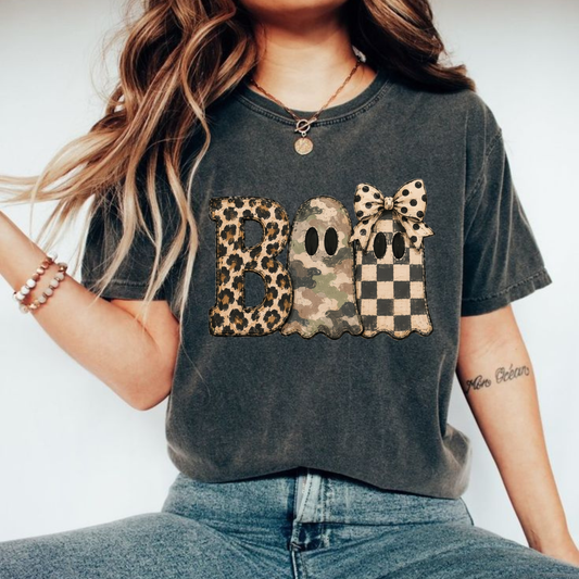 Front view of the wild haunt boo tee displaying retro leopard camo BOO typography graphic artwork across the chest of a Comfort Colors shirt. - dogmomhat
