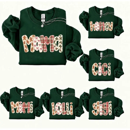 Front view of the yule pine heritage crewneck displaying personalized family name gingerbread plaid graphic artwork across the chest of a forest green sweatshirt. - dogmomhat
